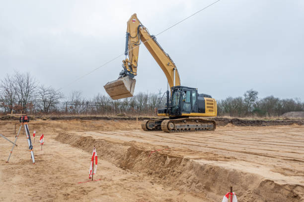 istock a building site there is a yellow excavator preparing the ground for foundations 1204755064