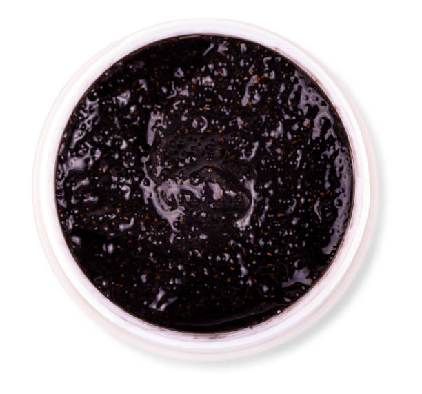istock black Body scrub in Jar on white background 1204756358