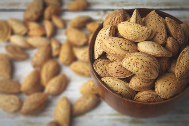 istock Healthy Almond Nuts in shells 1204757386