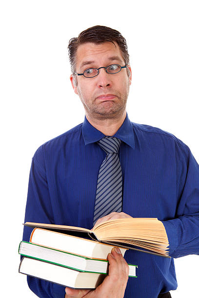 istock male nerdy geek is reading books 120475952