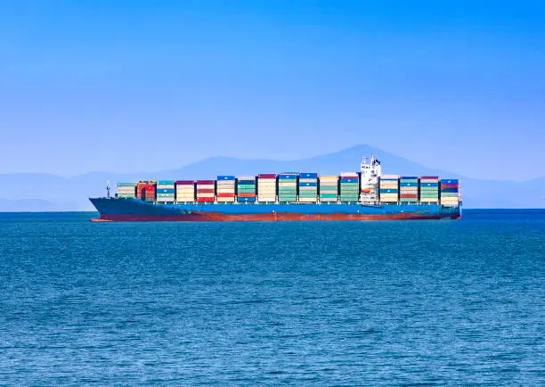 The Large container ship at blue sea