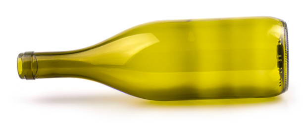 istock Empty glass bottle lying on its side, isolated over white background 1204761244