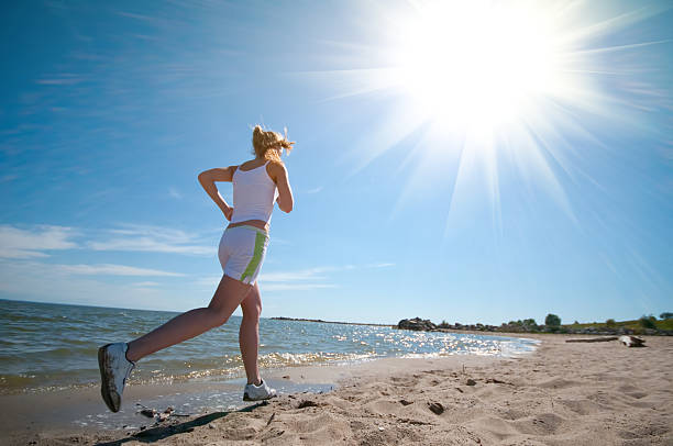 istock Sport woman running on beach 120476234