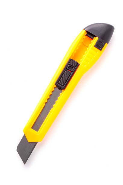 istock yellow stationery knife isolated on white background 1204763470