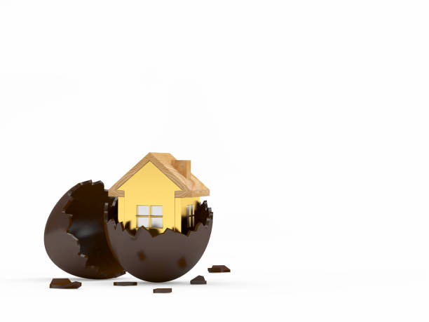 istock Golden house icon on broken chocolate egg with space for text 1204767985