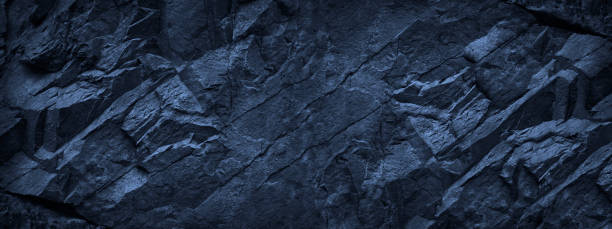 istock Dark blue grunge background. Deep blue stone background. Toned mountain texture close-up. 1204769821