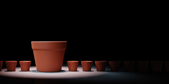 One Big Empty Flowerpot Between a Set of Small Flowerpots Spotlighted on Black Background with Copy Space 3D Illustration