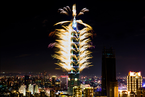 TAIPEI, TAIWAN - January 1, 2017 - Fireworks ring in the New Year at the Taipei 101 building.