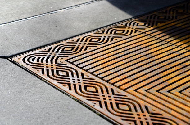 istock Decorative iron tree grate along a city sidewalk in Redmond town center 1204773537