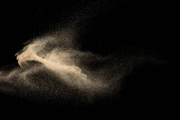 istock Brown dry river sand explosion isolated on black background. Abstract sand splash. 1204773795