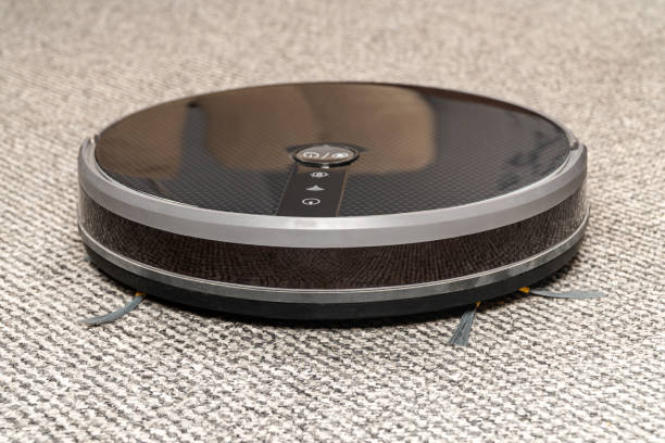 istock robot vacuum cleaner on a gray carpet 1204773981