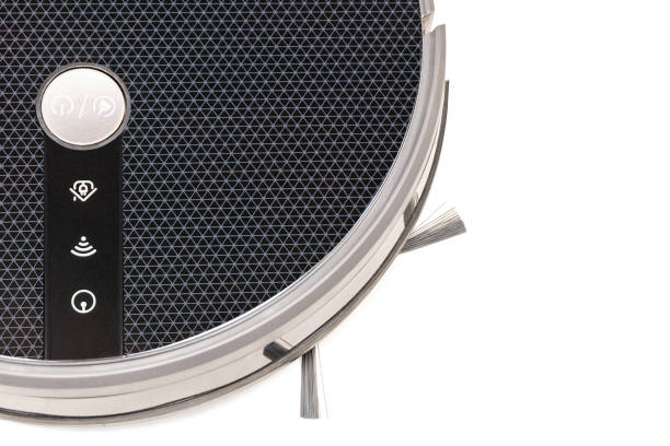 istock Robot vacuum cleaner brush close up 1204774086