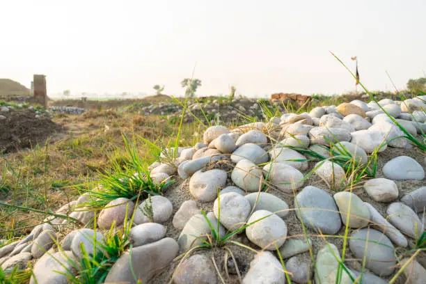 Photo of stones kept on grave in a graveyard