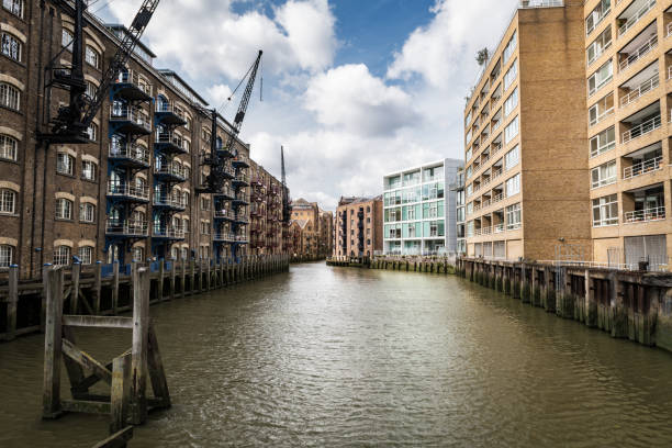Wide-angle view of the St Saviours Dock in London from a footbridge, UK.