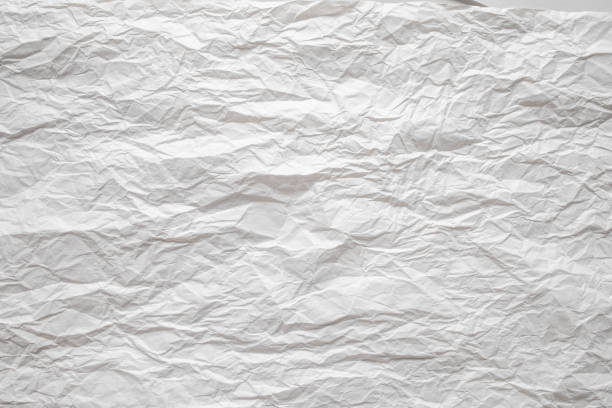 istock White crumpled paper close up texture background 1204779576