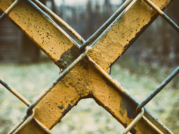 istock Yellow X at a fence 1204779698
