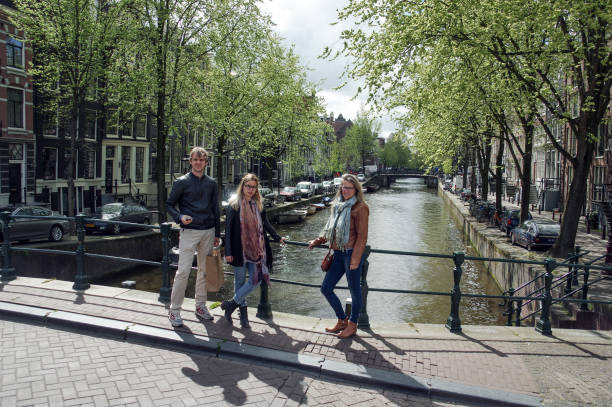 Amsterdam, the Netherlands, - April 28, 2015. family making a city trip to the Dutch capital Amsterdam.