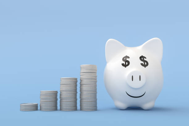istock Incrementing Finance with Piggy Bank on Blue Background 1204781168