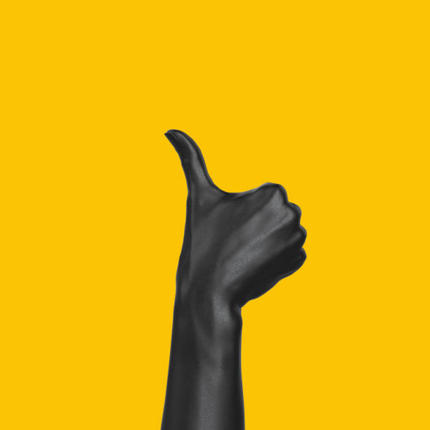 istock Thumb up black hand gesture isolated yellow, yes like sculpture creative concept, 3d rendering 1204781895