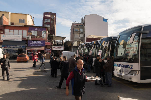 Istanbul, Turkey - Jan 17, 2020:Travellers waiting to board at theEmniyet Garaj Bus Terminal in Istanbul, Turkey. Travellers traveling to the Balkans, Armenia, Georgia or Iran wait to board on a coach and load their bags at the bus terminal Turkey, Istanbul, Emniyet, bus terminal. Emniyet Garaj Bus Terminal.