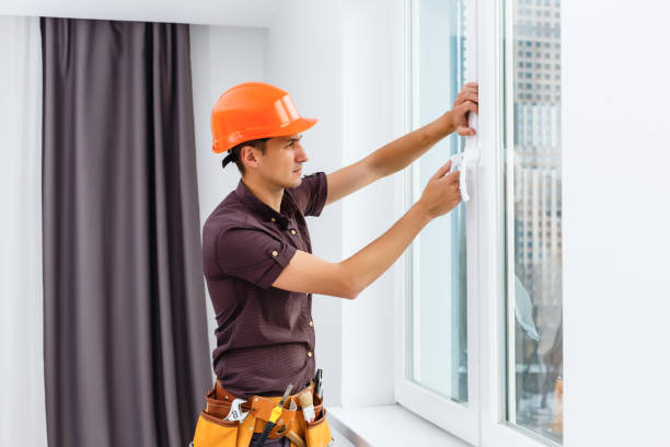 istock Workman repairing a large picture window 1204785442