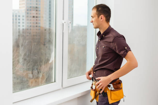 istock Workman repairing a large picture window 1204785529