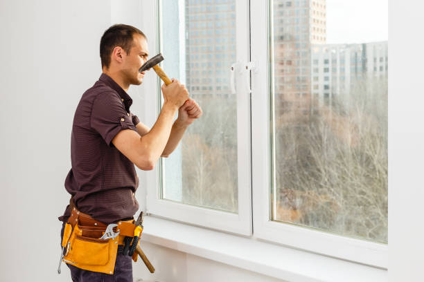 istock Workman repairing a large picture window 1204785593