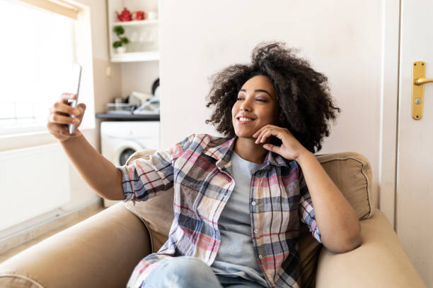 istock Woman blowing air kiss 1204785834