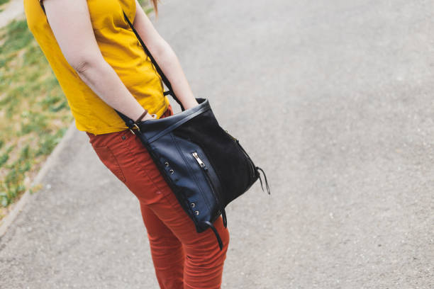 istock Girl searching in purse 1204788014