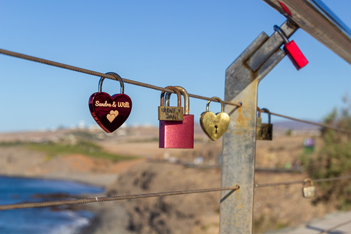 Locks on a chain at Meloneras to express never ending love