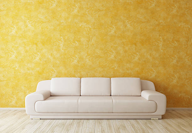 istock Modrn White Sofa near Wall in Sunny Yellow Interior Room 120479002