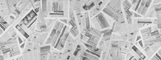 istock Long horizontal banner with lots of old newspapers, Blurred Background 1204790526