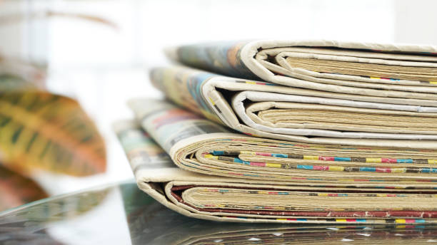 istock Pile of Newspapers on the table 1204790597