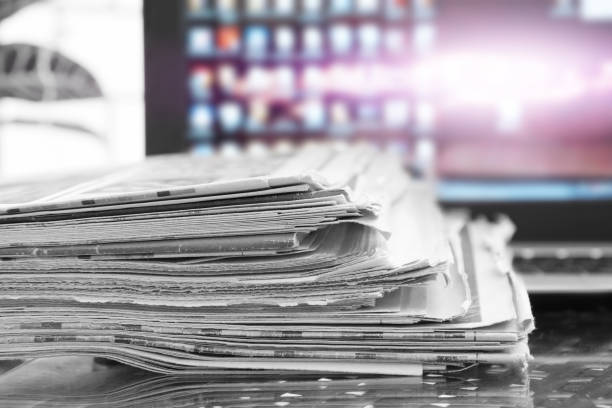 istock Newspapers and Laptop 1204790617