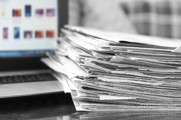 istock Newspapers and Laptop 1204790650