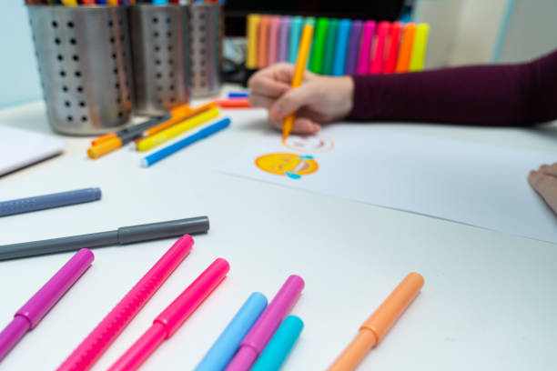 istock Girl drawing emojis 1204793426