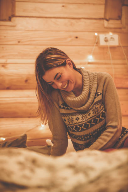 istock Happy woman smiling and looking downwards 1204795227