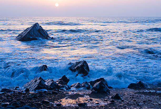 istock Evening sunset over rocks,Sandy mouth bay,Cornwall 120479984