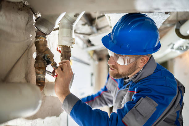 istock Male Worker Inspecting Valve 1204813781