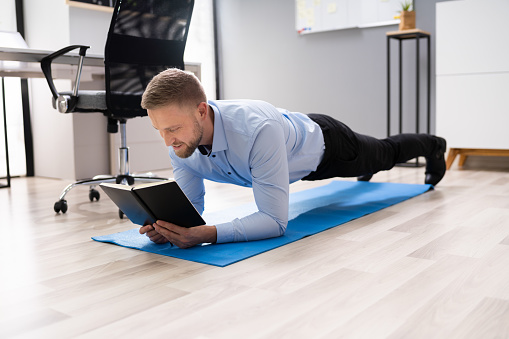 Exercising While Reading Businessman Reading Notes While Exercising Stock Photo - Download Image ...