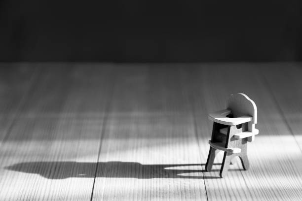 Brown wooden chair on gray background