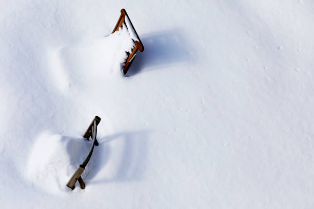 istock Garden in Montreal with chairs covered in snow 1204817508