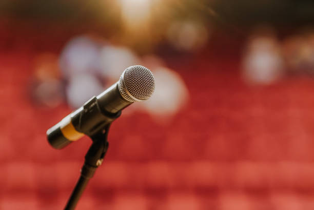 istock Close Up of Microphone Standing at Stage Before Concert 1204820092
