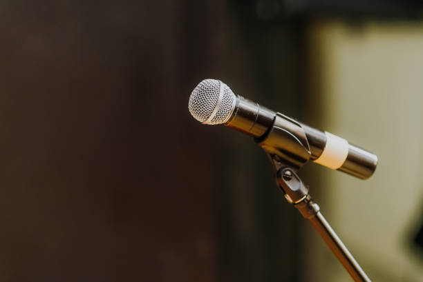 istock Close Up of Microphone Standing at Stage Before Concert 1204820132