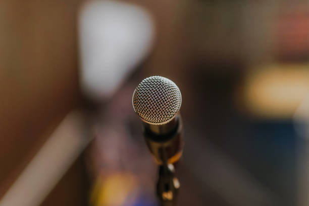 istock Close Up of Microphone Standing at Stage Before Concert 1204820231
