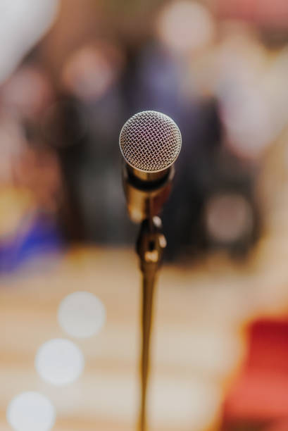 istock Close Up of Microphone Standing at Stage Before Concert 1204820251