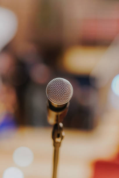 istock Close Up of Microphone Standing at Stage Before Concert 1204820839