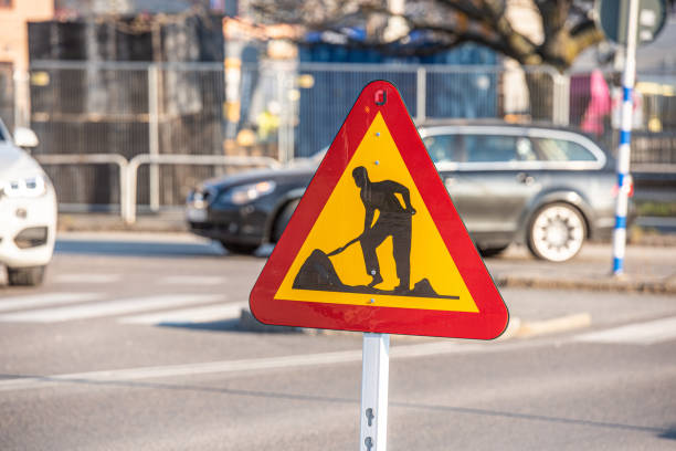 istock Sign showing roadworks at a crossing. 1204821469
