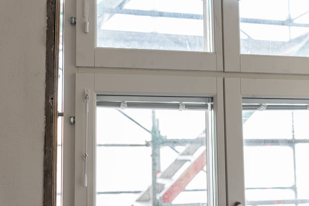 istock A window in the process of being replaced, seen from the inside. 1204821597