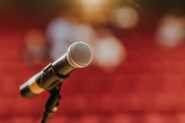 istock Close Up of Microphone Standing at Stage Before Concert 1204821630